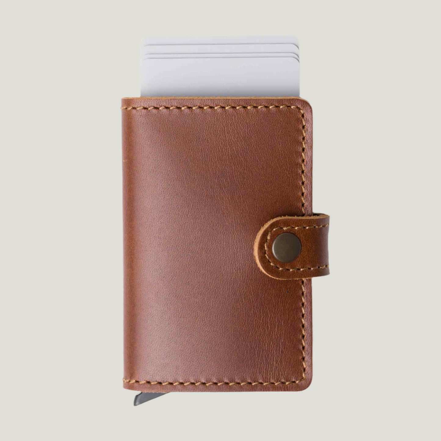 Close-up of the Agustine Leather Wallet in Rum, handcrafted from premium leather. Features quick card access, a sleek trigger action, and fire-branded initials.