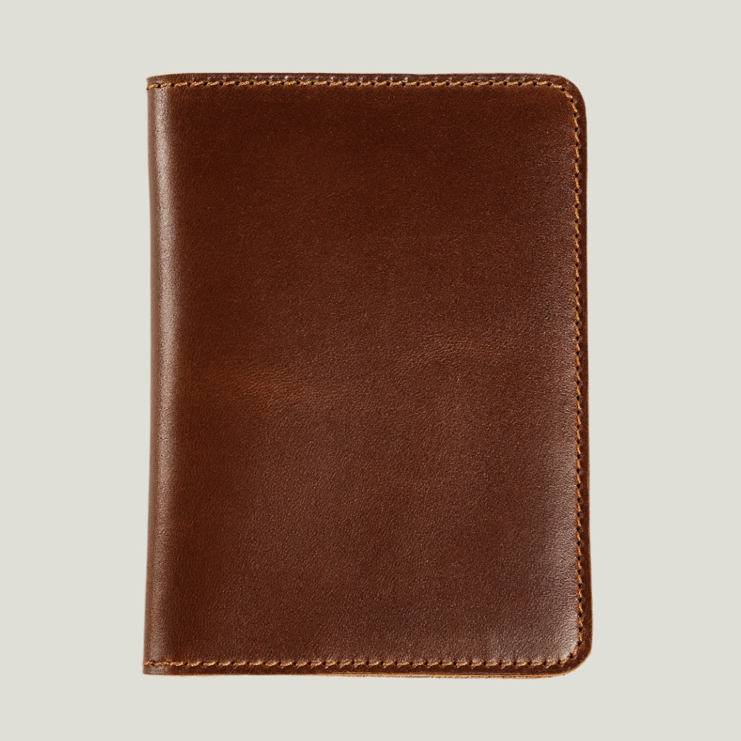 Handcrafted Pike Leather Passport Wallet in Taba by Atelier PEGAI, featuring premium rustic leather, four card slots, and personalization options for a unique touch.