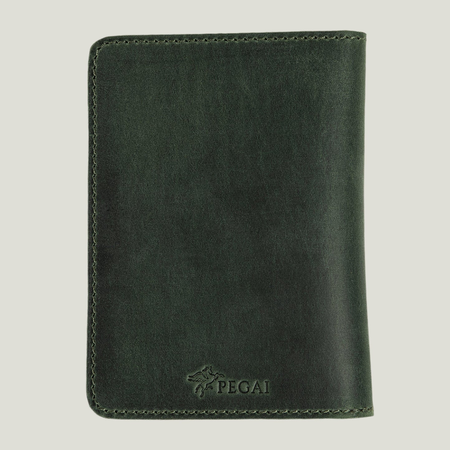 Green Pike Leather Passport Wallet by Atelier PEGAI, handcrafted with premium leather, featuring card slots and personalization for a stylish, travel-ready look.