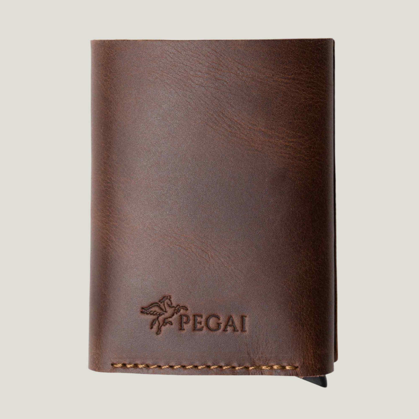 Antique Brown Mack Leather Trifold Wallet – a sleek, handcrafted design with quick card access, premium materials, and timeless style, made in Ubrique, Spain.