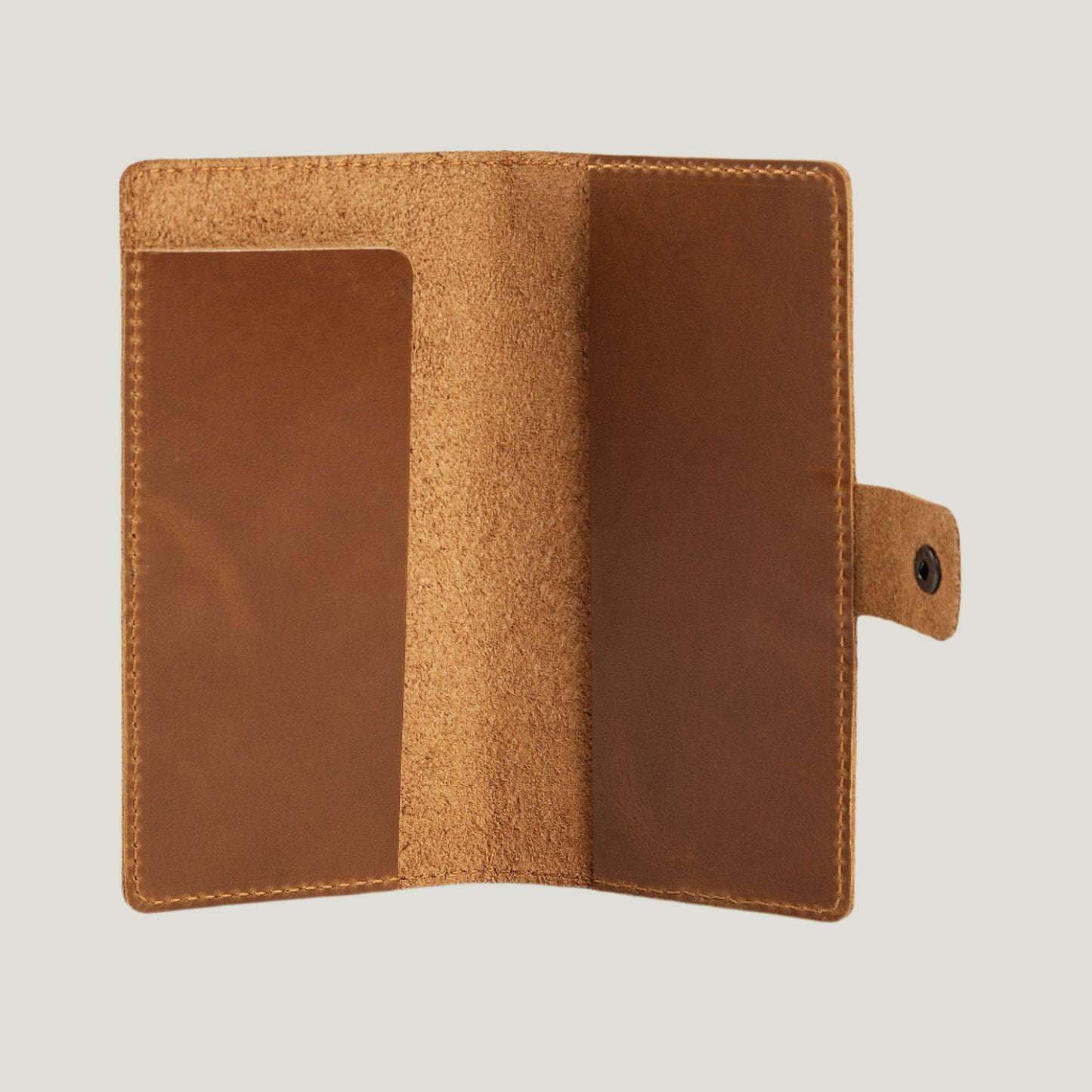 Mustard leather checkbook cover with antique brass snap closure, extra pocket for essentials, and fire-branded initials for a personal touch. Handcrafted in Spain.