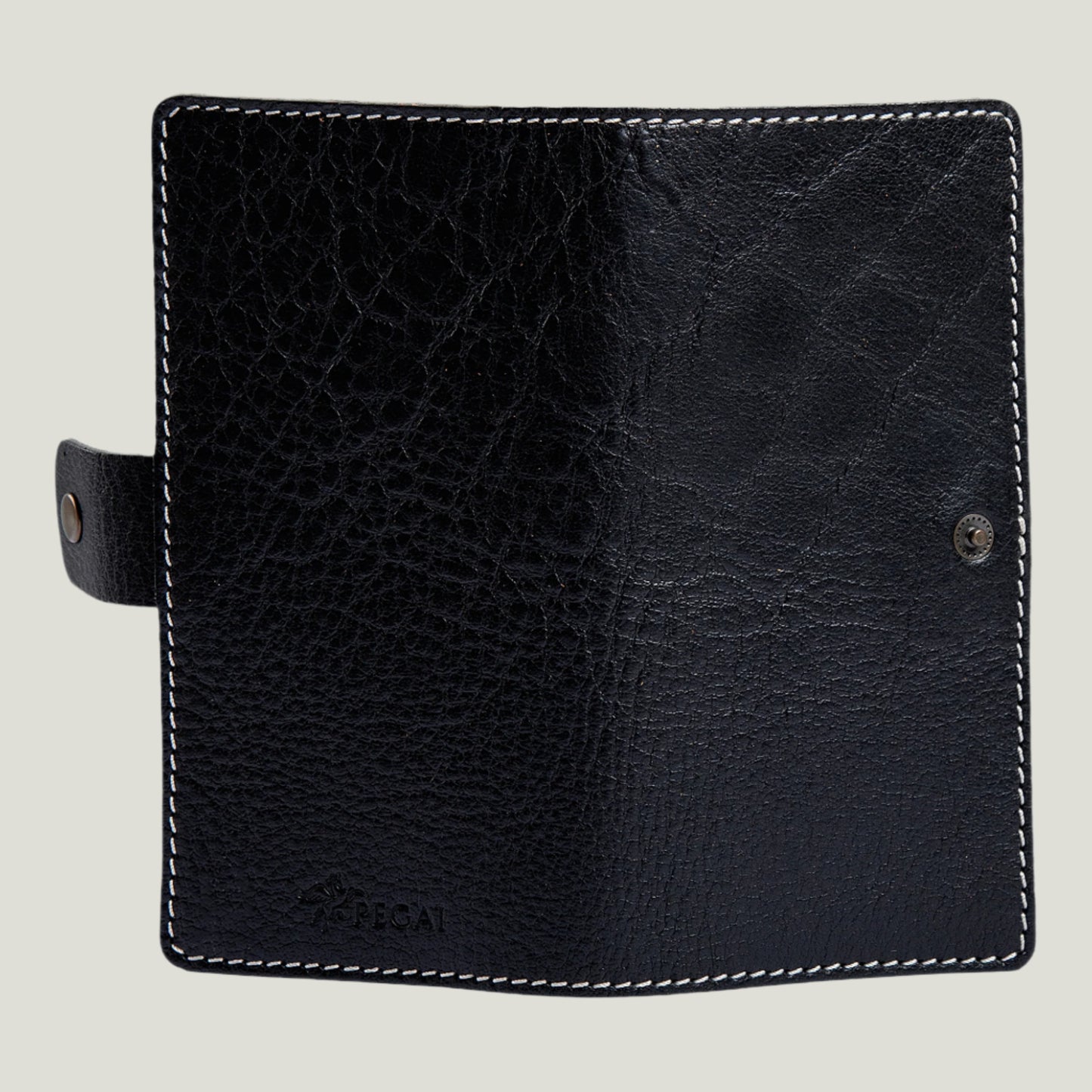 Phokion Black Clark Leather Checkbook Cover with antique brass snap, extra pocket, and personalized fire-branded initials, handcrafted in Ubrique by Tanner Leatherstein.