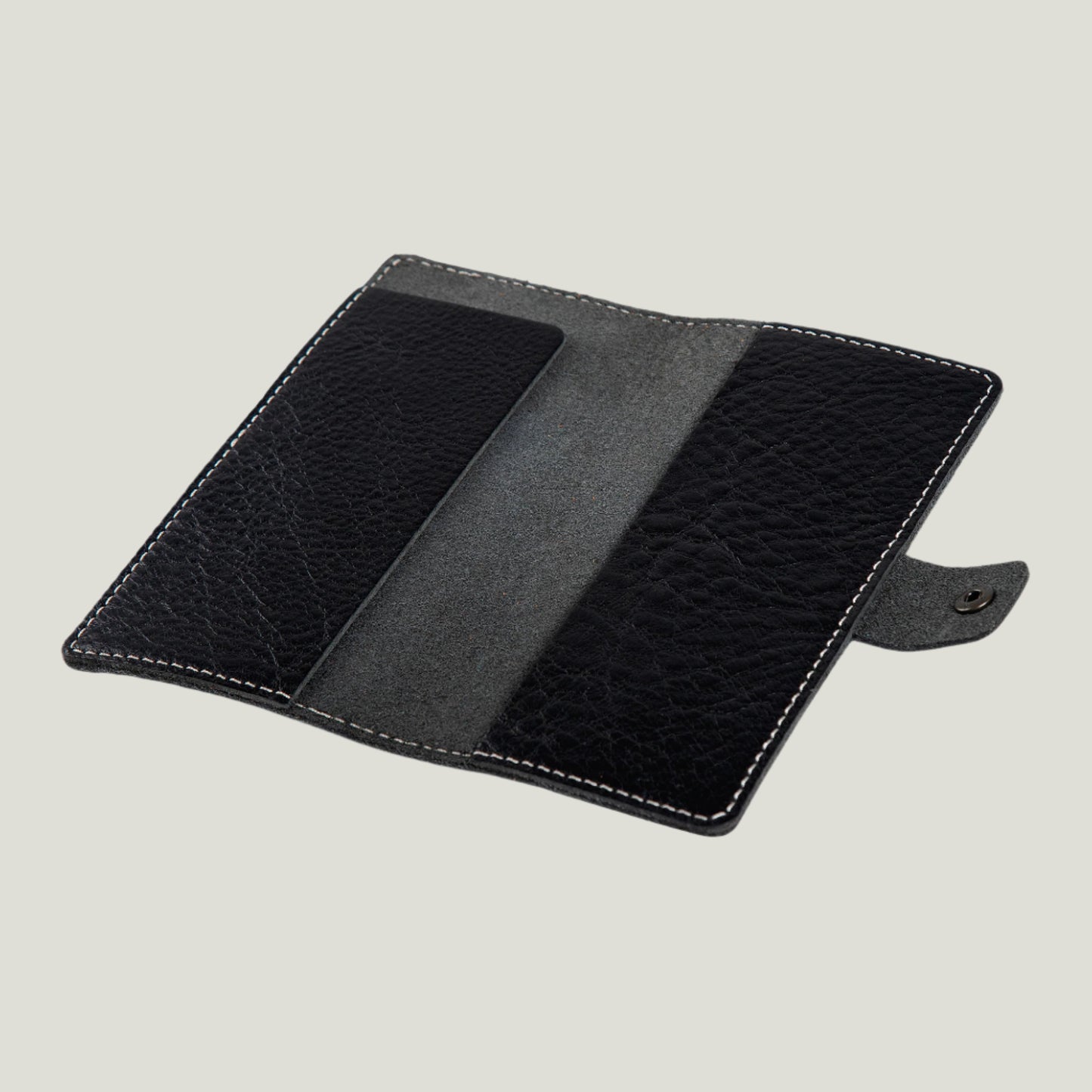 Phokion Black Clark Leather Checkbook Cover with antique brass snap, extra pocket, and personalized fire-branded initials, handcrafted in Ubrique by Tanner Leatherstein.