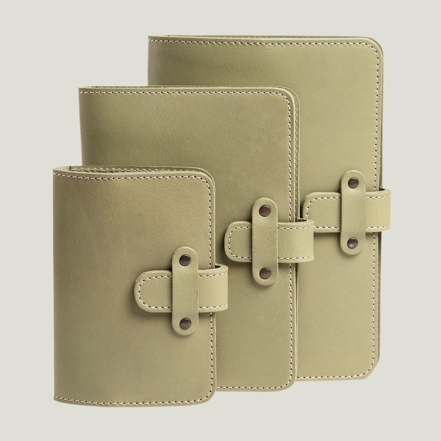 Handcrafted Aqua DuPage Leather Journal by Atelier PEGAI with refillable pages, antique brass hardware, and personalized fire-branded initials.