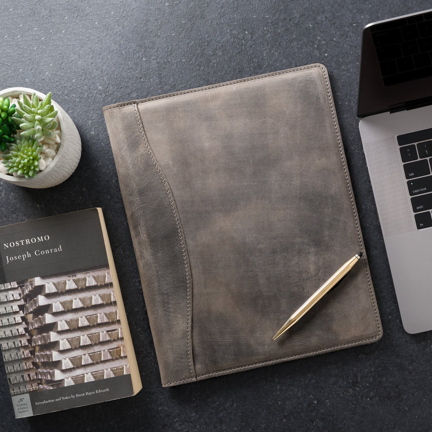 Rock-colored leather padfolio with pen holder, business card pocket, and A4 folder. Designed for legal pads. Crafted by Atelier PEGAI with expert craftsmanship.