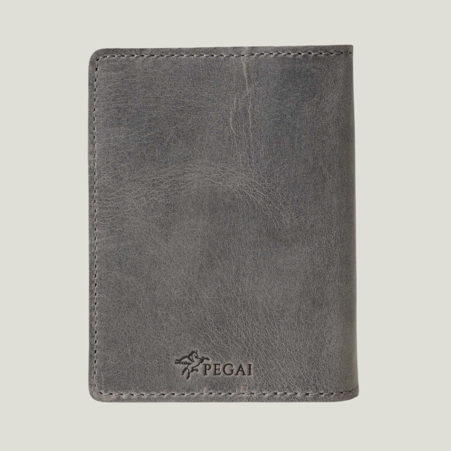 DeKalb Leather Passport Cover in Rock—handcrafted in Spain, featuring premium leather, dual pockets, and fire-branded personalization for a unique touch.