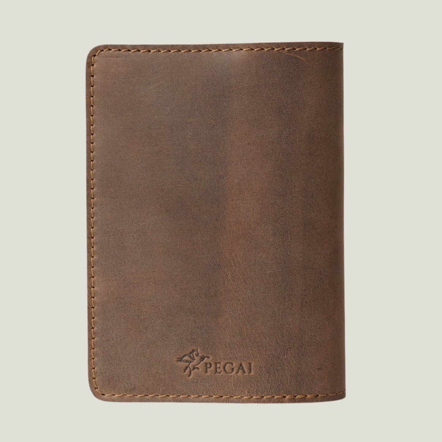 Handcrafted DeKalb Leather Passport Cover in Sand by Atelier PEGAI, made in Spain with top-grain leather, featuring personalized fire-branded initials.