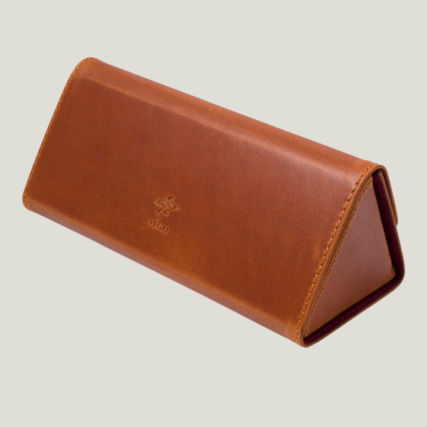 Elm Leather Eyeglasses Case in Whiskey Brown, crafted from authentic Pegai leather. Features a velvety interior, magnetic closure, and a fold-flat design for easy storage.