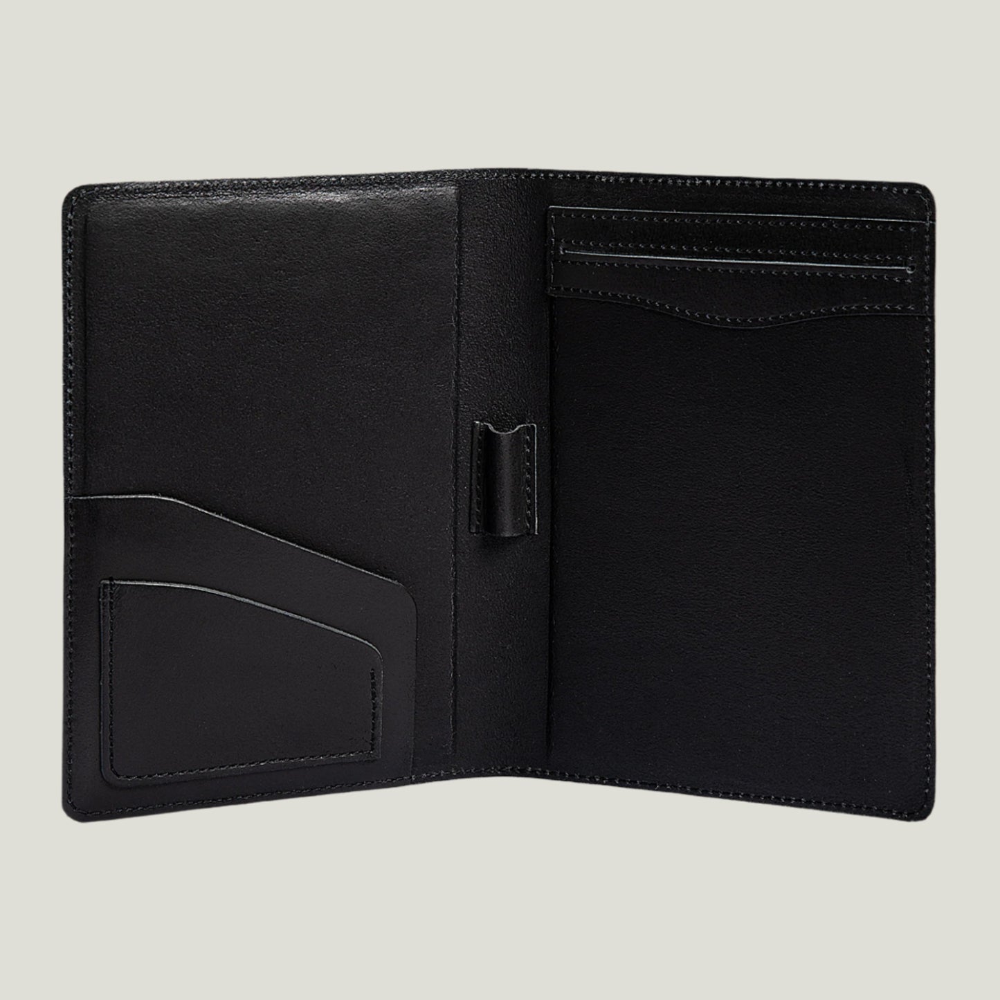 A charcoal leather padfolio handcrafted by Atelier PEGAI, featuring a pen holder, business card slot, and inside pocket. Designed for 8" x 5" legal pads, this sleek and durable padfolio is personalizable with fire-branded initials. A timeless blend of craftsmanship and function by leather expert Tanner Leatherstein.