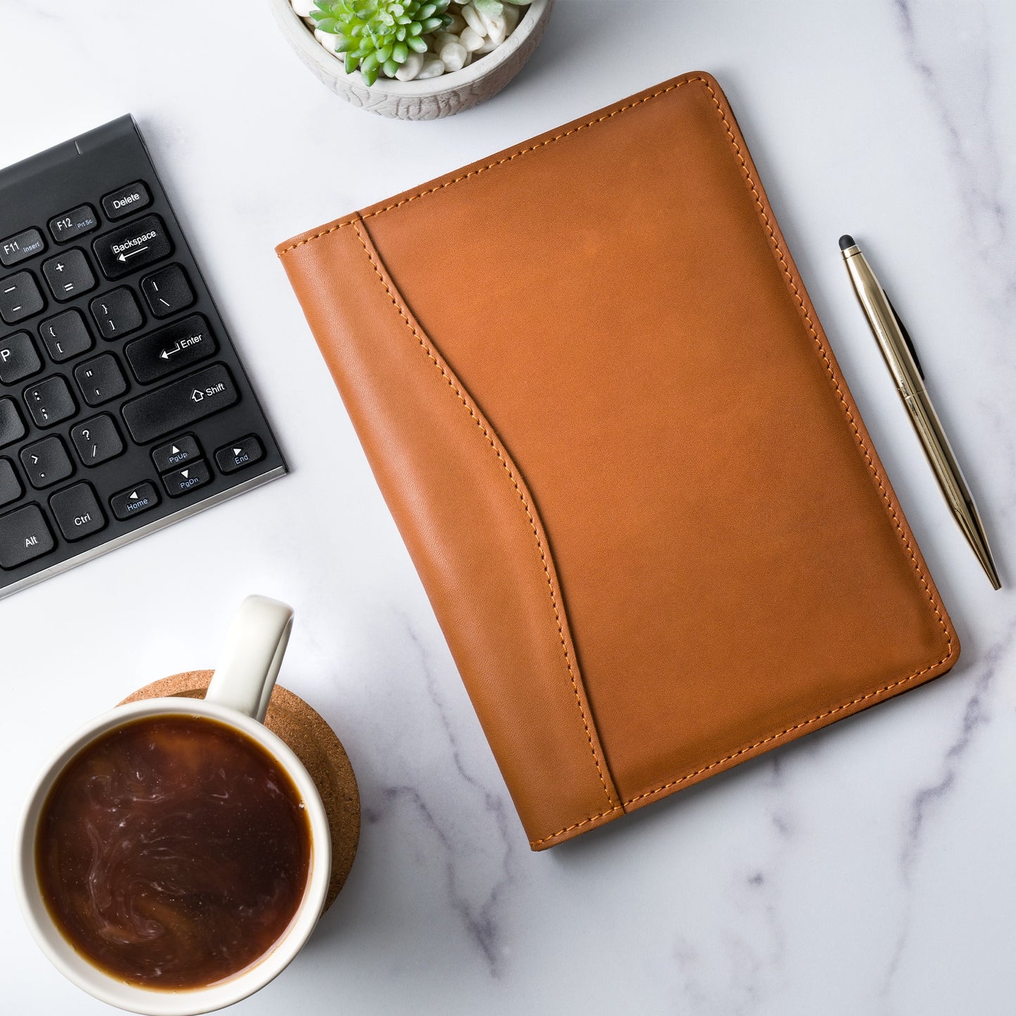 Close-up of the Eriksen Leather Jr. Padfolio in Cognac, crafted from premium leather. Features pen holder, business card slot, and personalization options.
