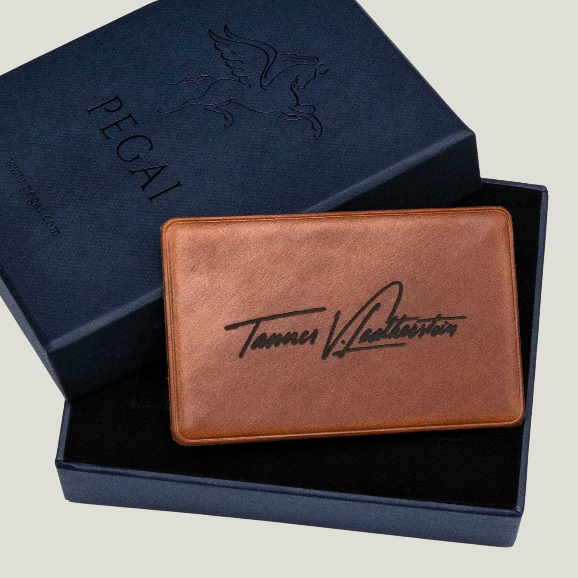 Whiskey Brown leather NFC business card with personalized engraving, crafted by Atelier PEGAI for seamless digital networking and a lasting first impression.