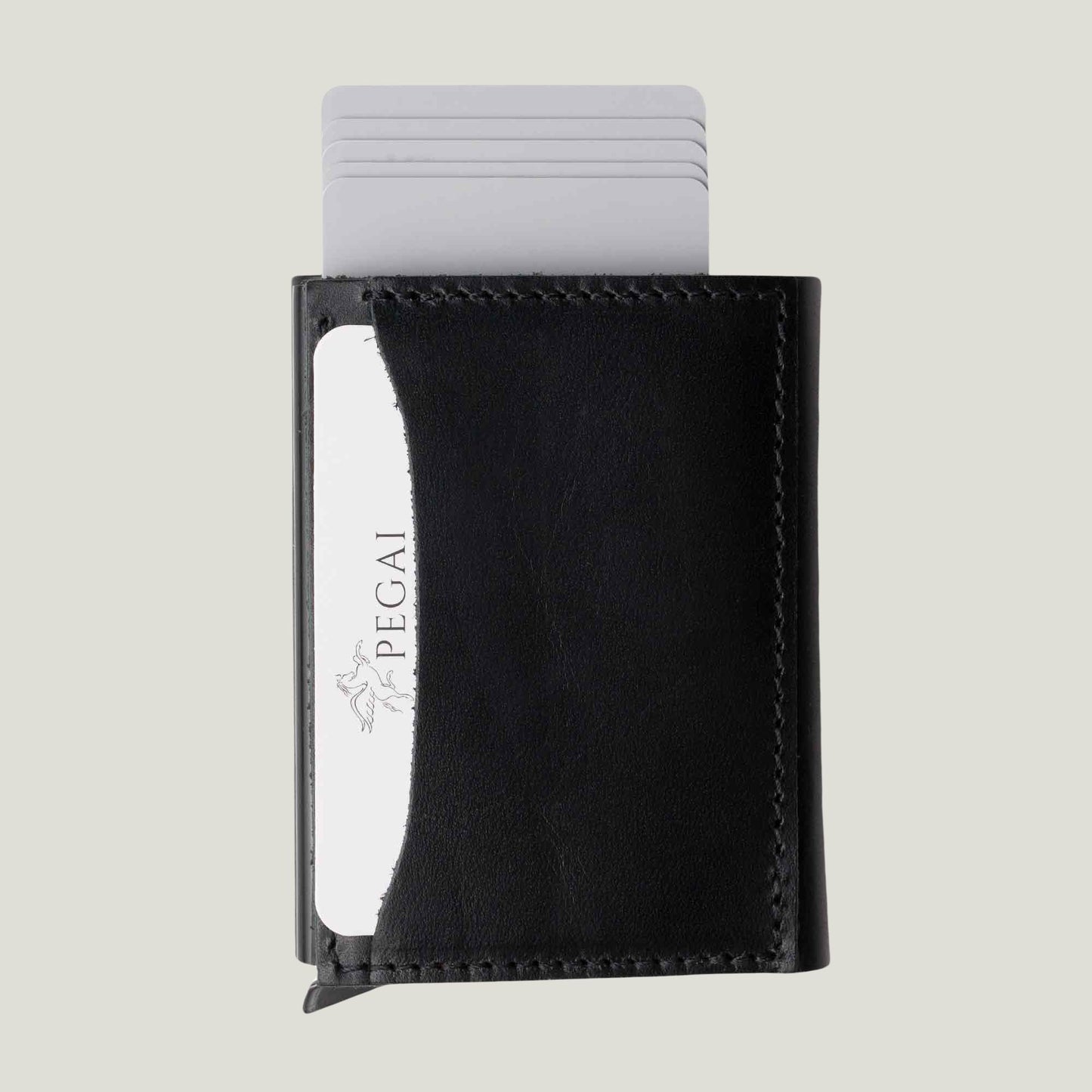 Close-up of the Mack Leather Trifold Wallet in black, showcasing its sleek, compact design, premium leather texture, and quick card access feature.