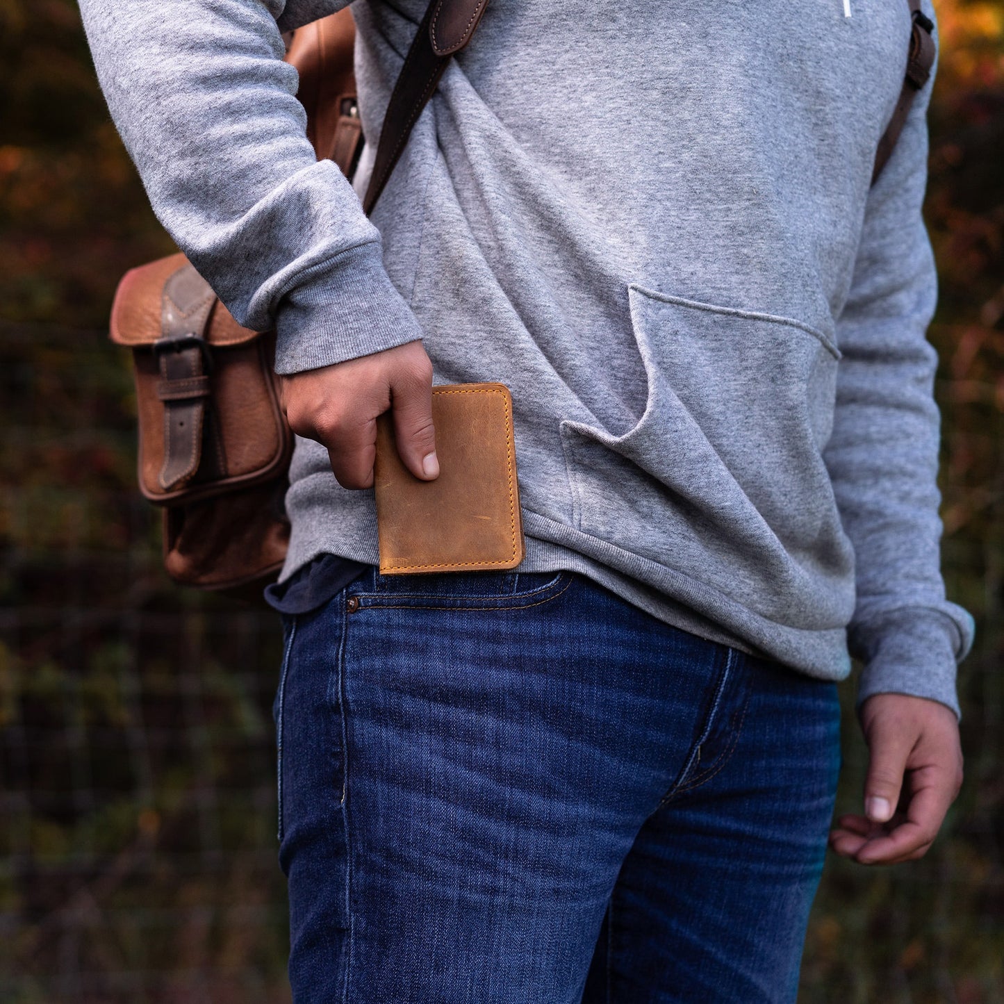 Close-up of the Knox Bifold Wallet in Cinnamon, crafted from top-grain leather with a rich patina. Features card slots, hidden pockets, and fire-branded initials.