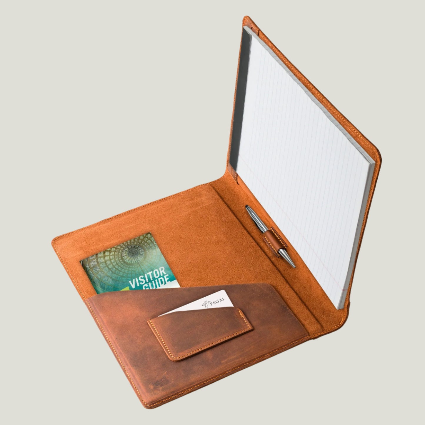 Mahogany leather padfolio with pen holder, business card pocket, and A4 folder. Designed for legal pads. Expertly crafted by Atelier PEGAI for timeless elegance and function.