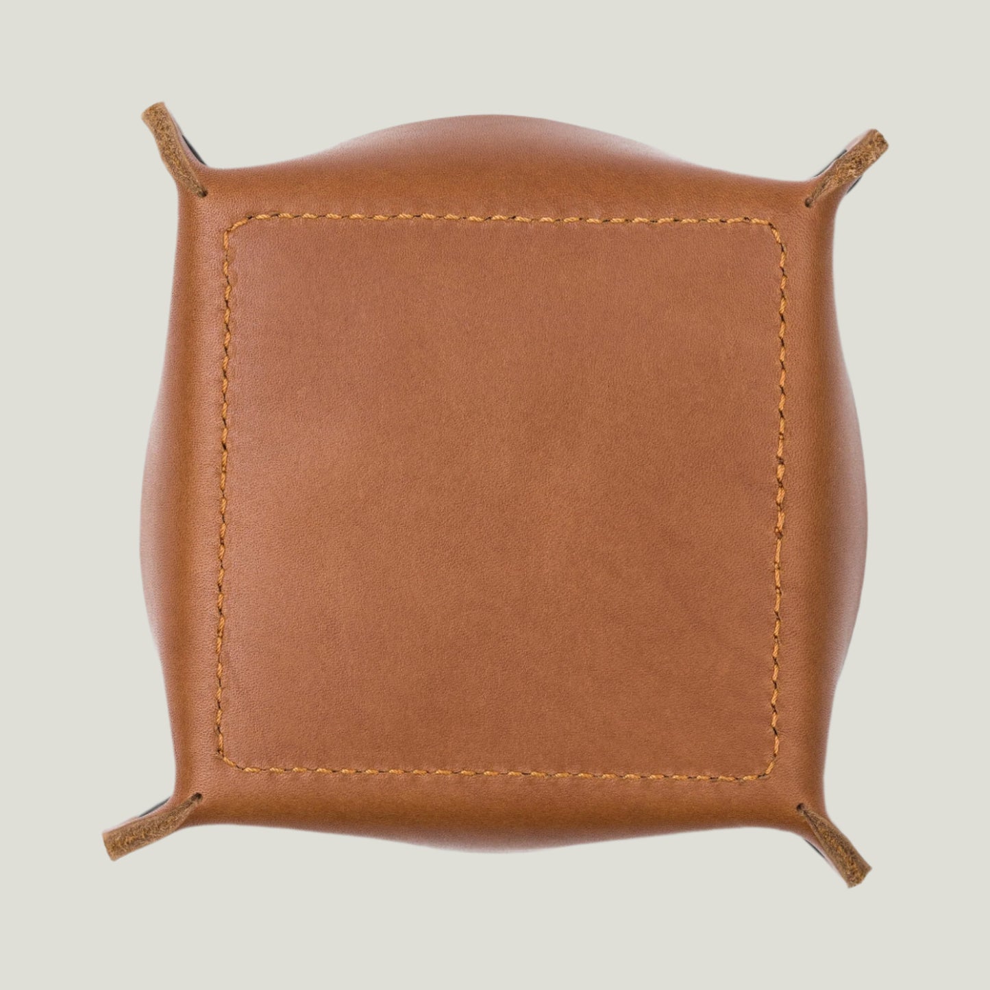 Rich Taba leather catchall tray with a soft suede interior, stitched base, and rustic charm—perfect for organizing keys, coins, and everyday essentials.