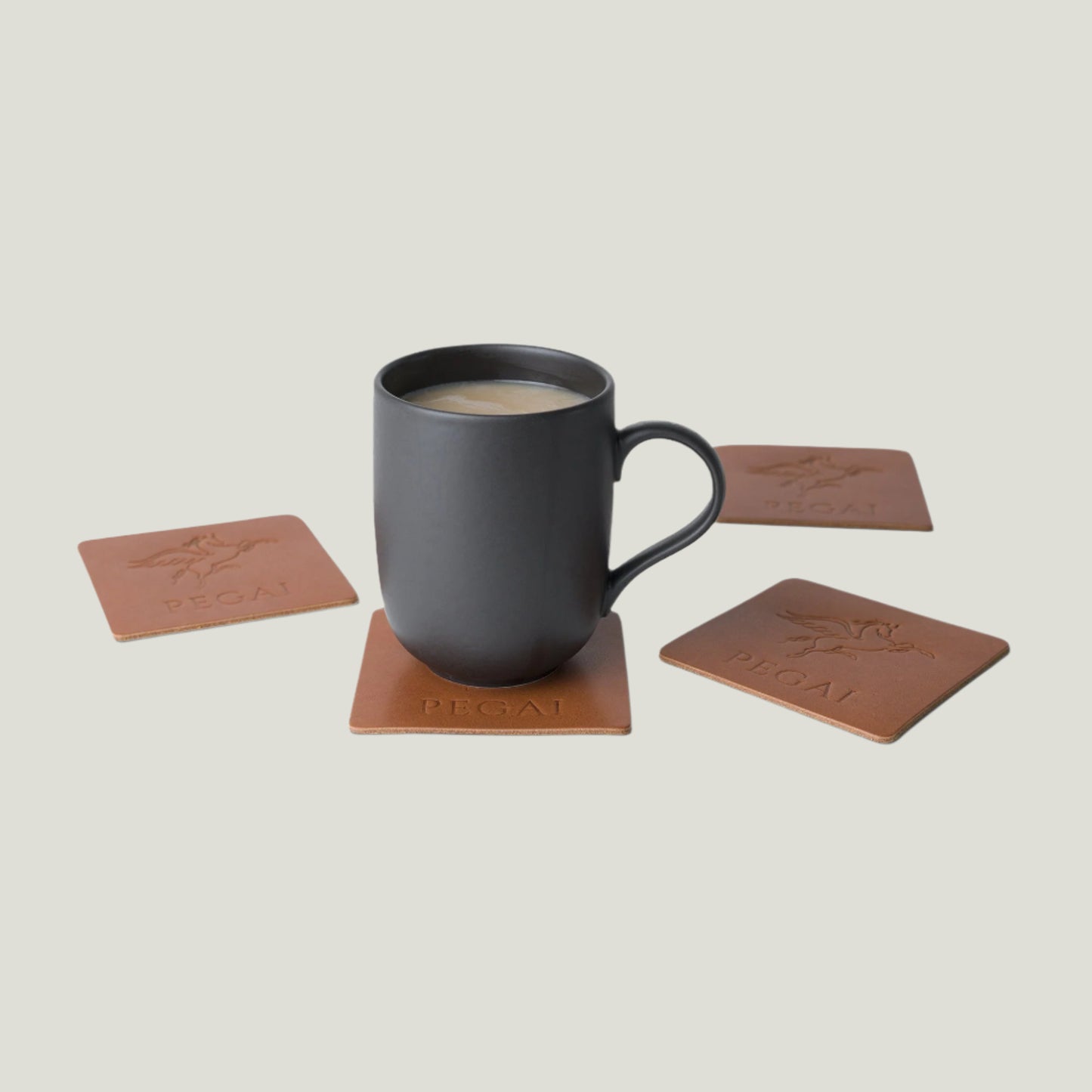 Taba Brown leather coaster set by Atelier PEGAI, handcrafted in Ubrique, Spain. Features expert craftsmanship and timeless design for a refined touch.