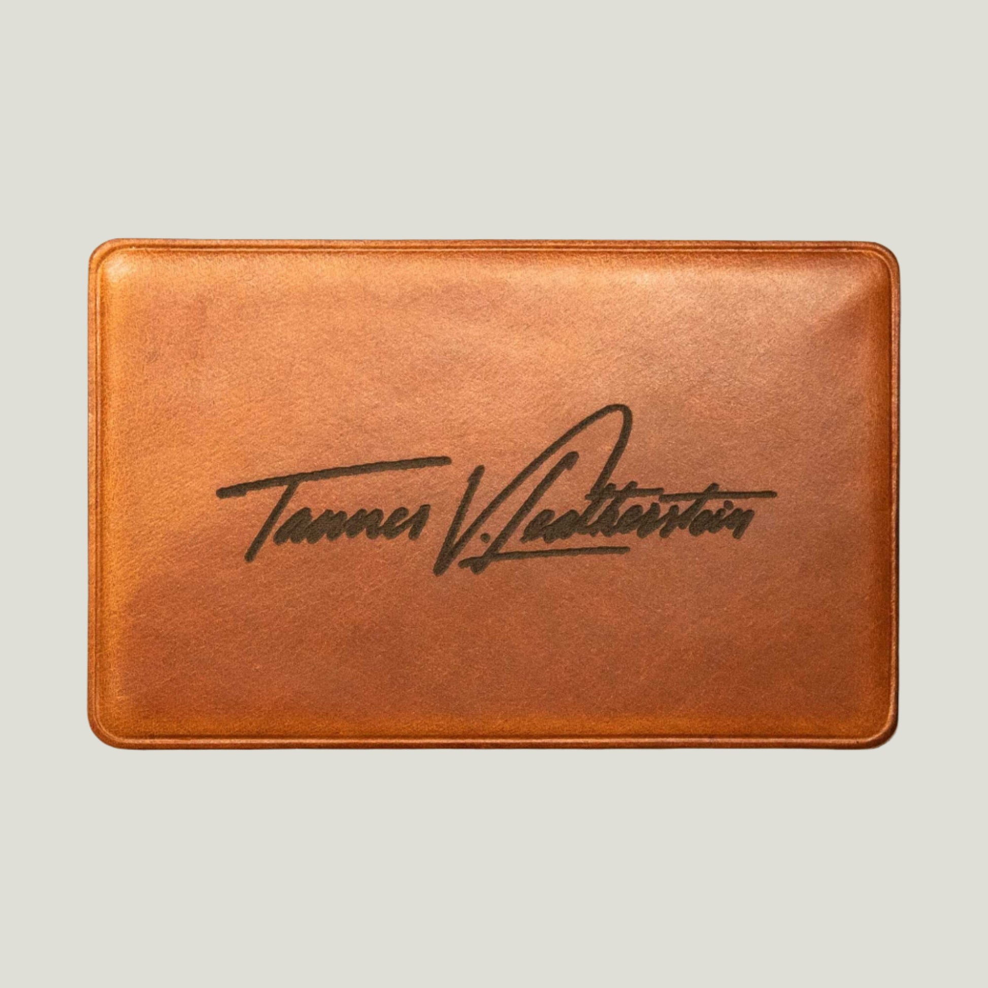 Whiskey Brown leather NFC business card with personalized engraving, crafted by Atelier PEGAI for seamless digital networking and a lasting first impression.