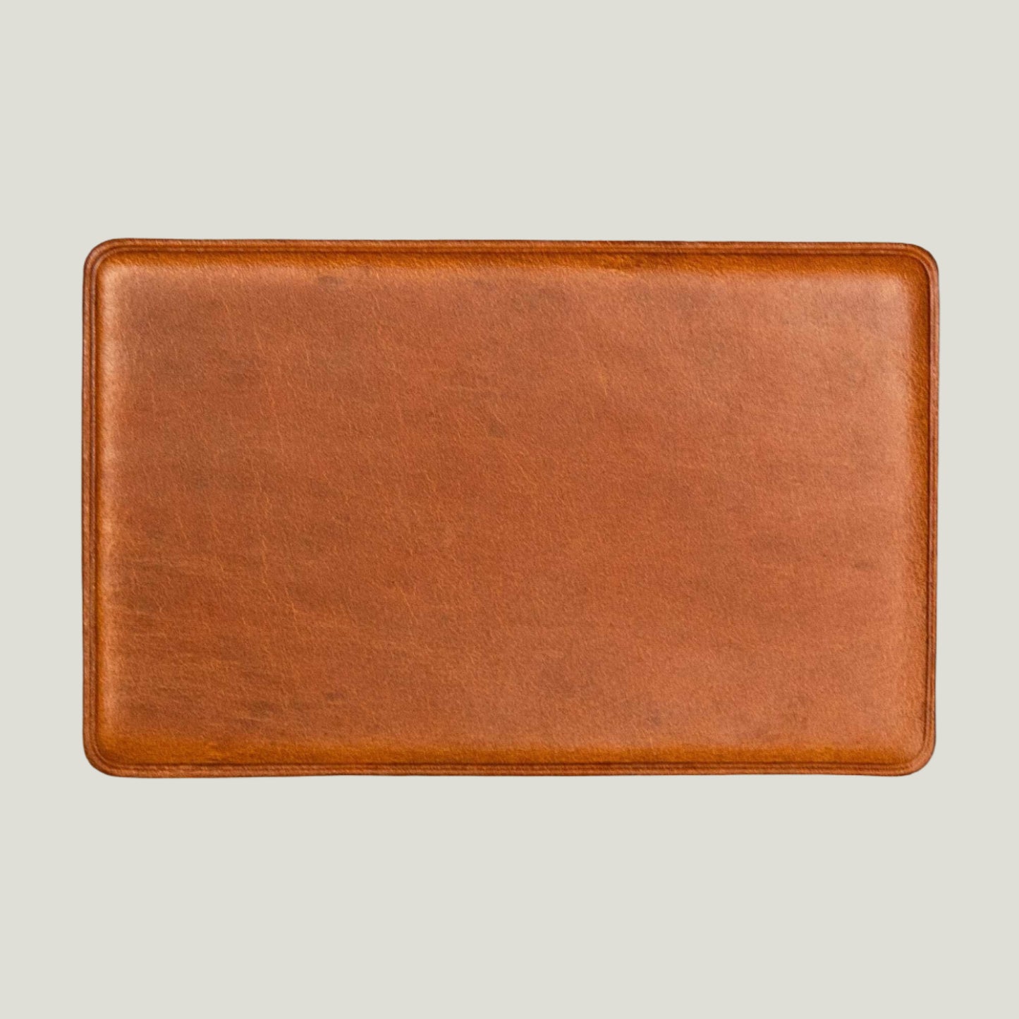 Whiskey Brown leather NFC business card with personalized engraving, crafted by Atelier PEGAI for seamless digital networking and a lasting first impression.