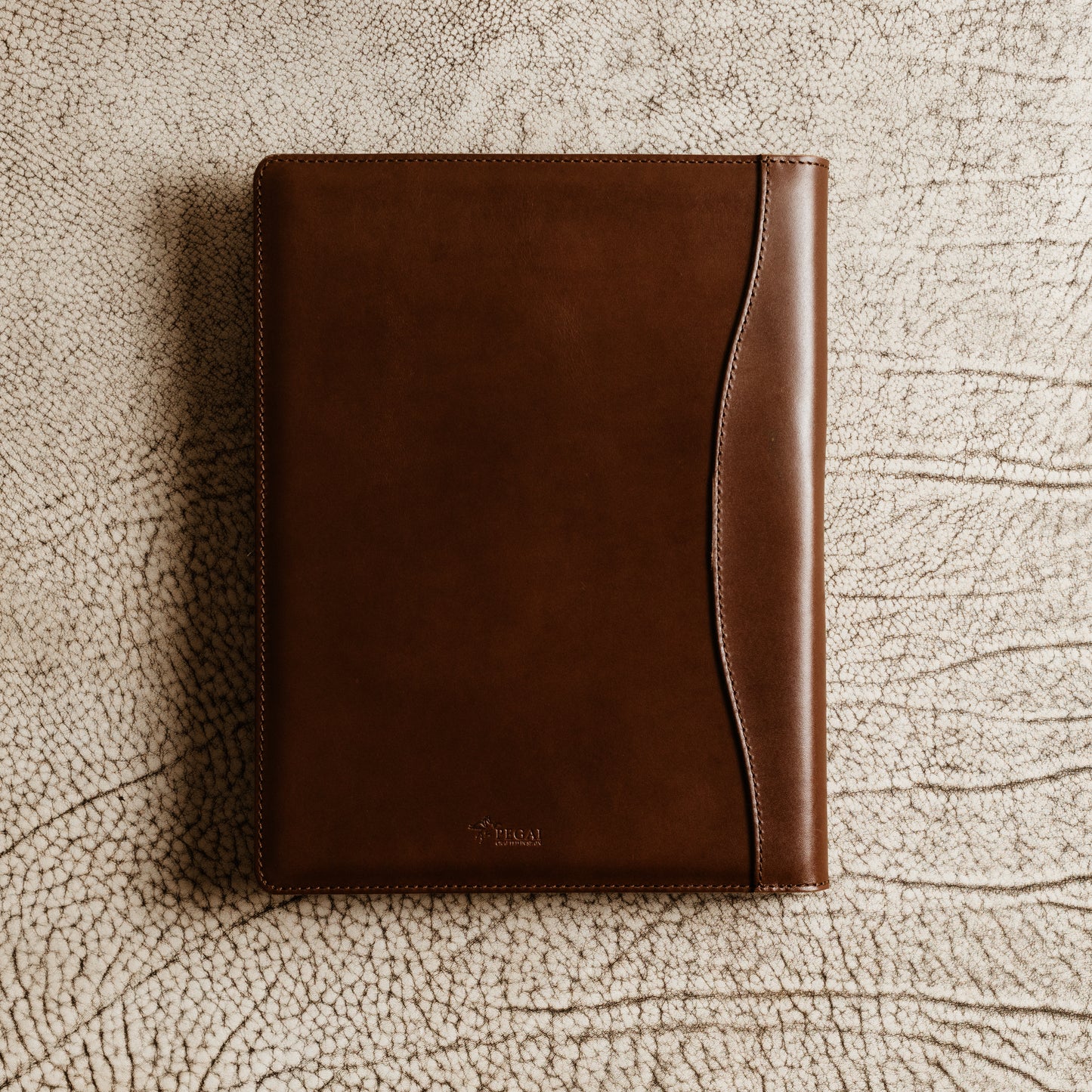 Slim leather padfolio in Barkley Brown with pen holder, business card pocket, and A4 folder—crafted by Tanner Leatherstein for legal pads.