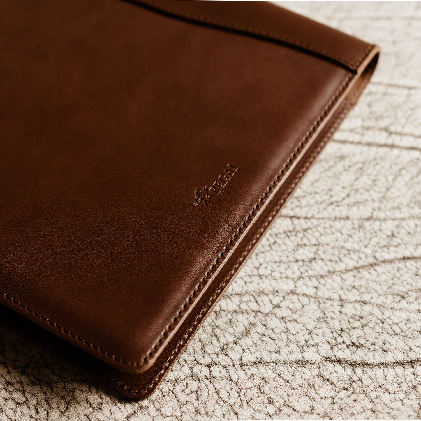 Slim leather padfolio in Barkley Brown with pen holder, business card pocket, and A4 folder—crafted by Tanner Leatherstein for legal pads.