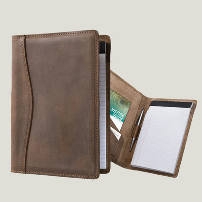 Elegant sand-colored leather padfolio with a pen holder, business card slot, and inside pocket, crafted by Atelier PEGAI. Designed for 8” x 5” legal pads, this handcrafted piece blends rustic charm with personalization, featuring fire-branded initials for a timeless, bespoke touch.