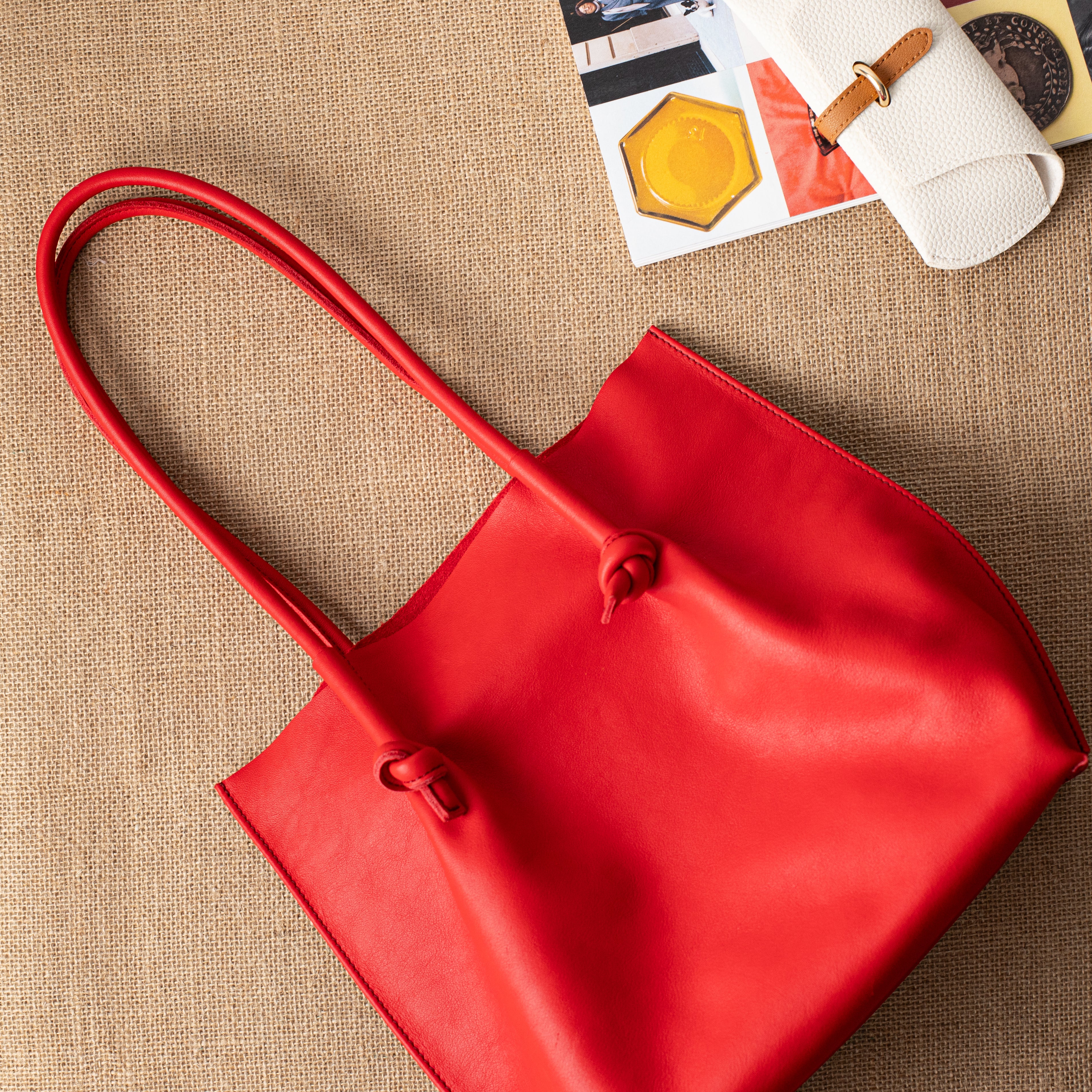 Flora Everyday Leather Tote in Smooth Calf Red with suede interior, rolled handles, and artisan edge details—crafted for bold, everyday elegance.