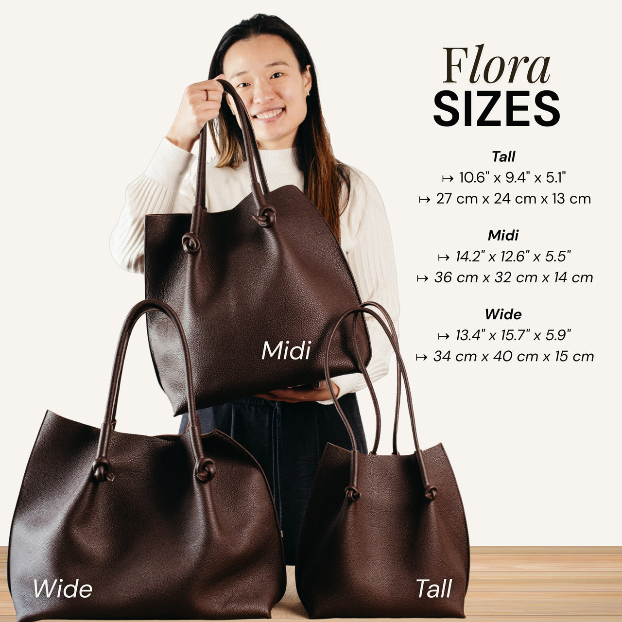 Woman holding Flora Leather Tote in Midi size, with Tall and Wide sizes displayed below—crafted in rich brown Togo leather with artisan details and timeless form.