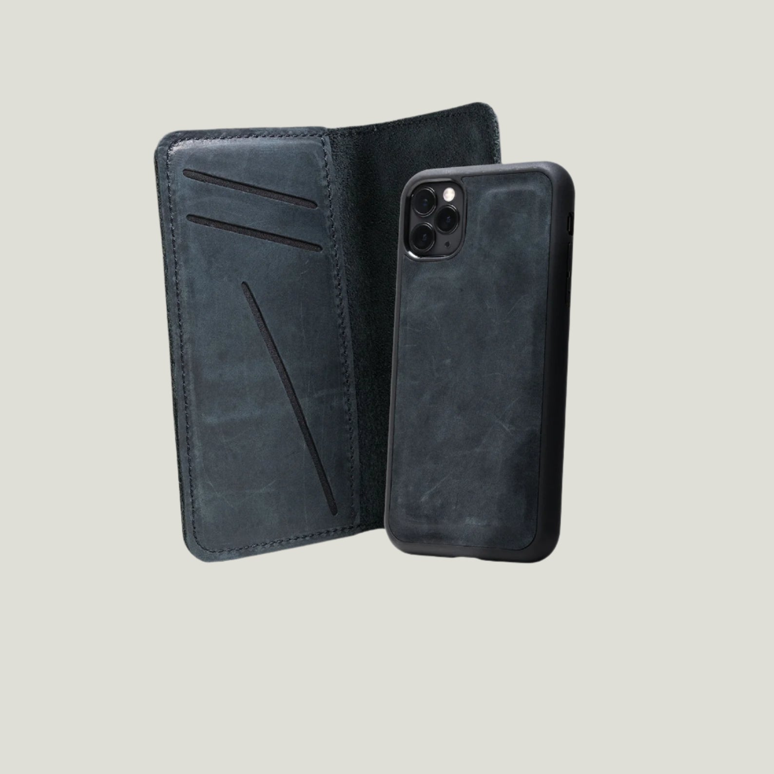 Close-up of the McLean iPhone Wallet made from full-grain leather, showing magnetic phone case, card slots, and rugged, handcrafted details.